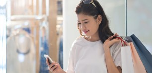 Woman shopping with a mobile phone