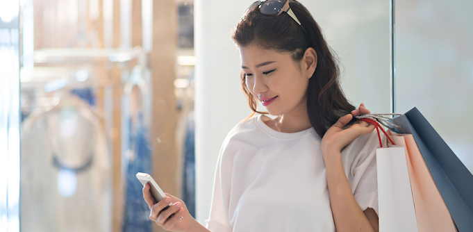 Woman shopping with a mobile phone