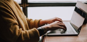 woman-typing-on-laptop