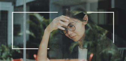 stressed out worker in shop window mental health challenges