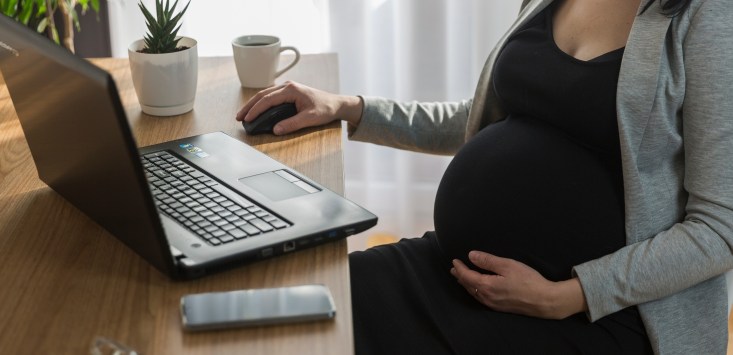 pregnant woman at work maternity leave paid workplace parental leave